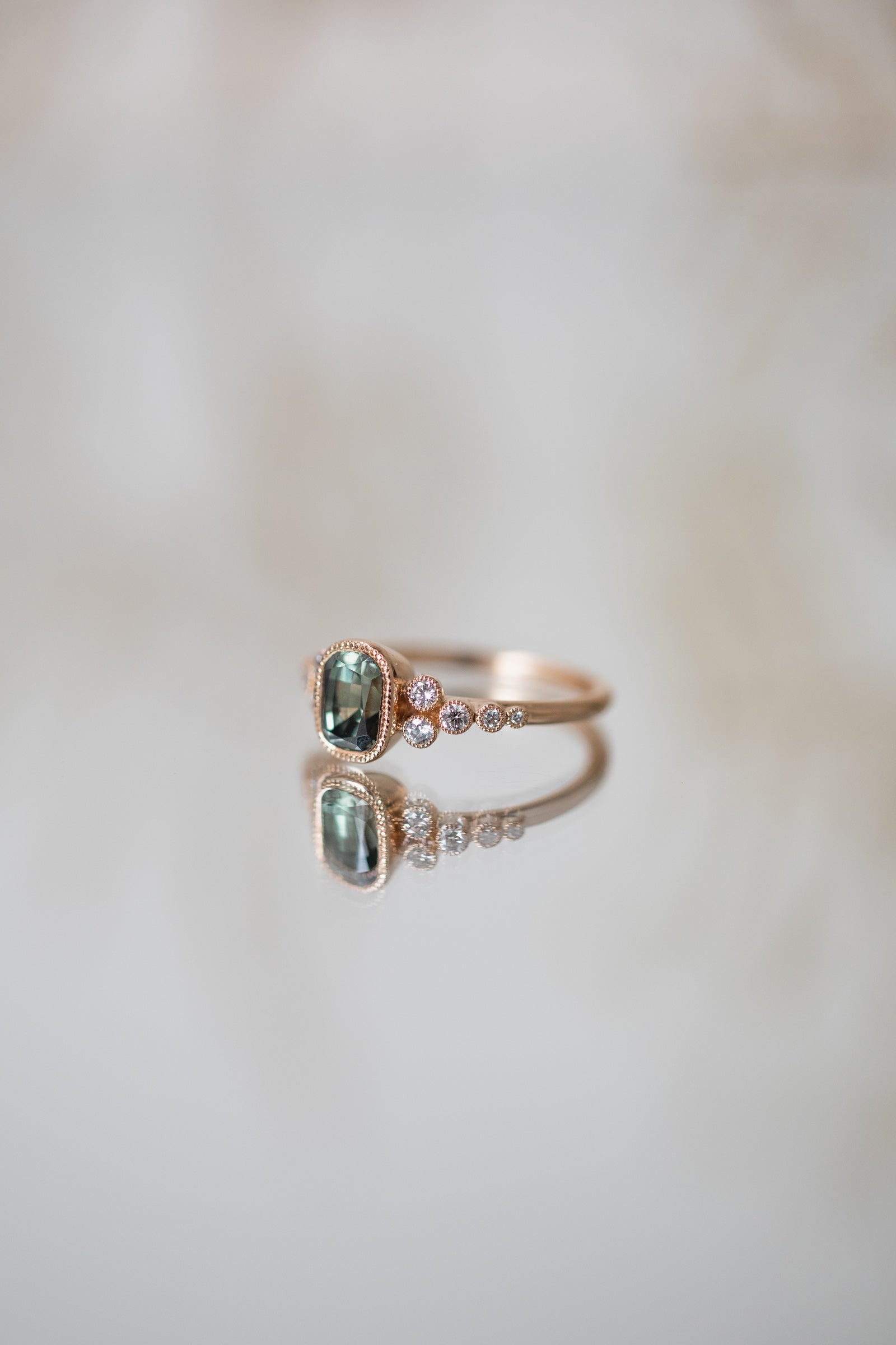 Designer engagement ring Unique piece in gold with natural blue-green umba sapphire and brilliant white diamonds Myrtille Beck