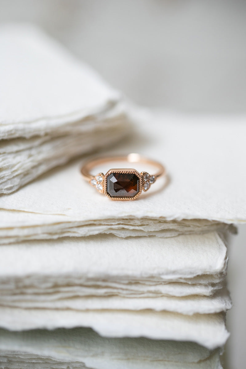 Designer engagement ring: A one-of-a-kind piece in gold featuring diamond rose-cut rectangular diamond with beveled edges and natural white brilliant-cut diamonds by Myrtille Beck