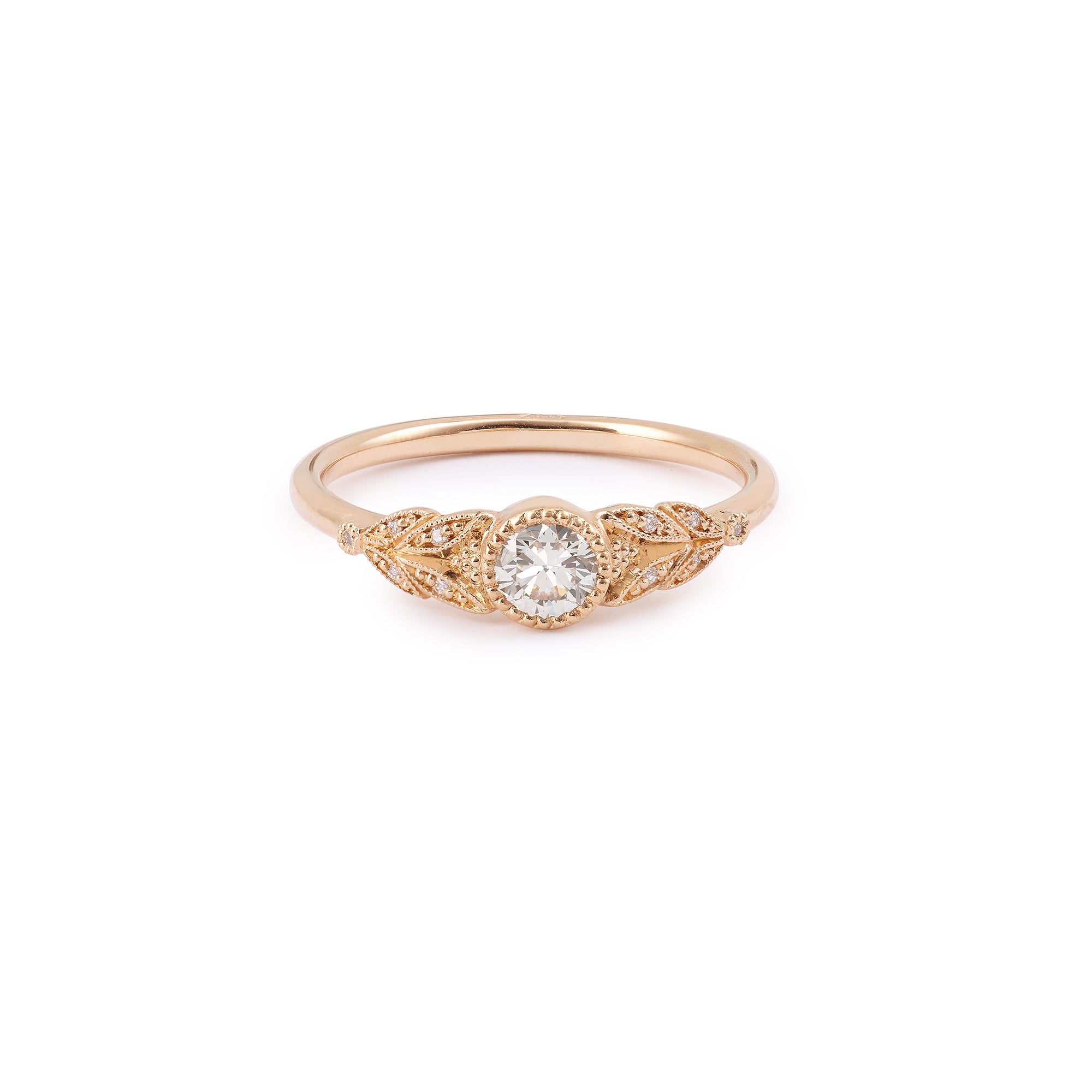 Designer engagement ring in gold with brilliant white diamonds by Myrtille Beck