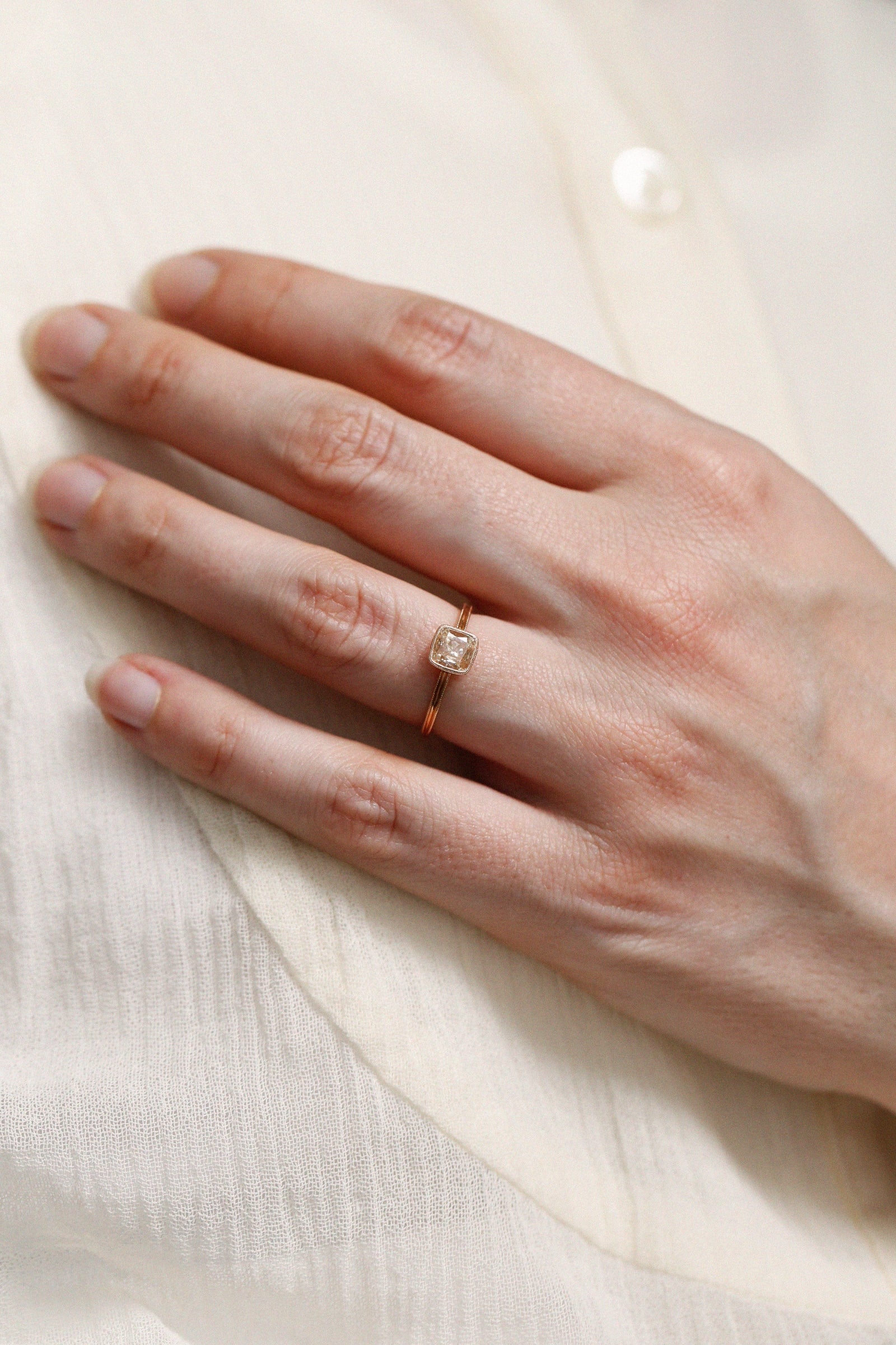 Single piece diamondsquare cushion, double Milgrain square ring