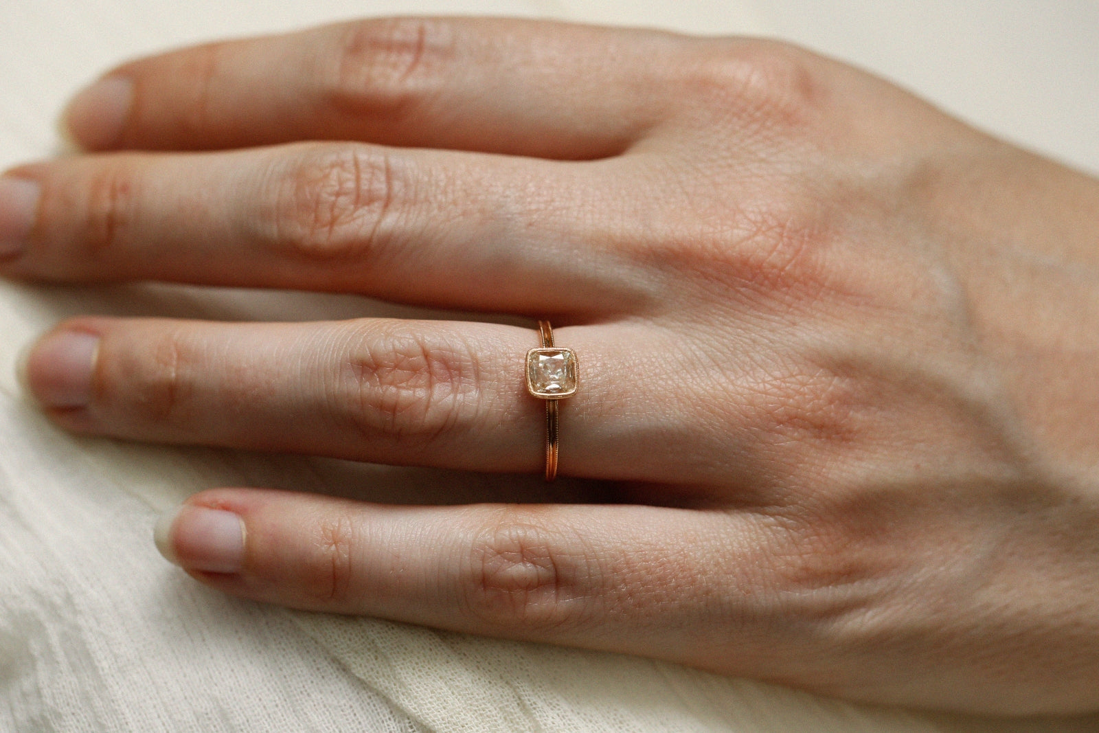 Single piece diamondsquare cushion, double Milgrain square ring