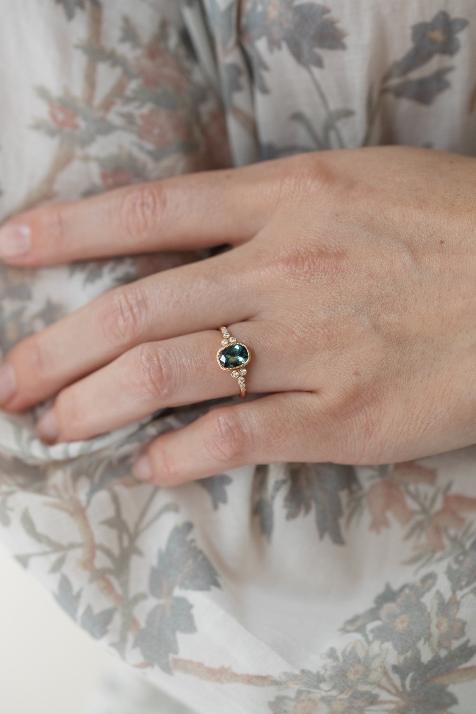 Designer engagement ring Unique piece in gold with natural blue-green umba sapphire and brilliant white diamonds Myrtille Beck