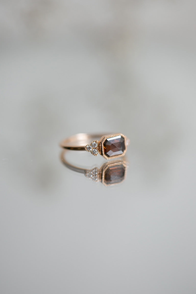 Designer engagement ring: A one-of-a-kind piece in gold featuring diamond rose-cut rectangular diamond with beveled edges and natural white brilliant-cut diamonds by Myrtille Beck