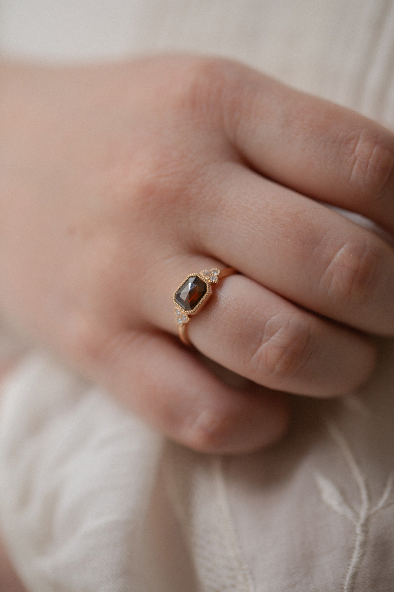 Designer engagement ring: A one-of-a-kind piece in gold featuring diamond rose-cut rectangular diamond with beveled edges and natural white brilliant-cut diamonds by Myrtille Beck