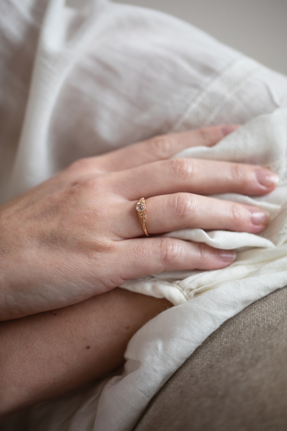 Designer engagement ring in gold with rose-cut white sapphire by Myrtille Beck