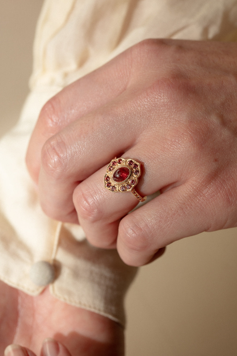 Designer Engagement Ring: One-of-a-kind piece in gold and sapphires, featuring a peach-colored Umba Myrtille Beck cabochon-cut Myrtille Beck